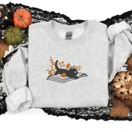 Embroidered Halloween Cat Sweater, Vintage Black Cat Lying on Book Sweatshirt