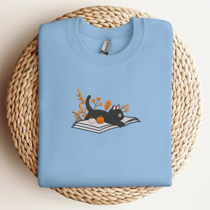 Embroidered Halloween Cat Sweater, Vintage Black Cat Lying on Book Sweatshirt