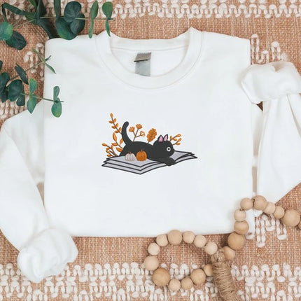 Embroidered Halloween Cat Sweater, Vintage Black Cat Lying on Book Sweatshirt