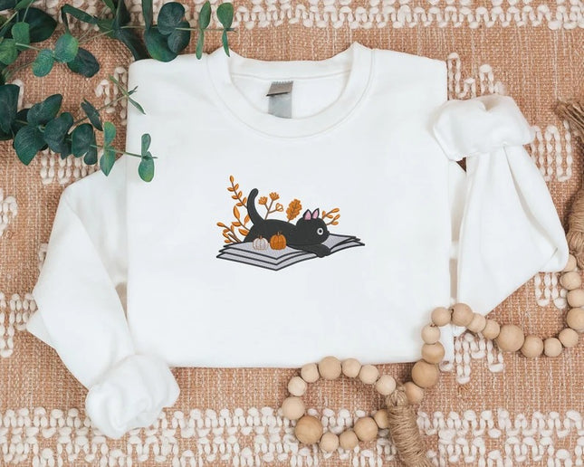 Embroidered Halloween Cat Sweater, Vintage Black Cat Lying on Book Sweatshirt, Autumn Fall Pumpkin Jumper, Witch Halloween Outfit Gifts