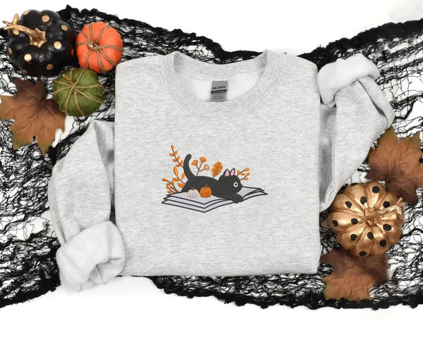 Embroidered Halloween Cat Sweater, Vintage Black Cat Lying on Book Sweatshirt, Autumn Fall Pumpkin Jumper, Witch Halloween Outfit Gifts