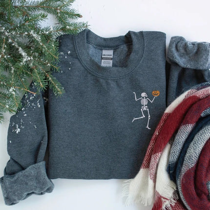 Dancing Skeleton Embroidered Sweatshirt, Funny Skeleton Carrying Pumpkin Halloween Monogrammed Jumper, Spooky Season Halloween Party Outfits